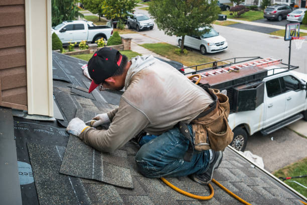 Professional Roofing technician working in Head of the Harbor, NY